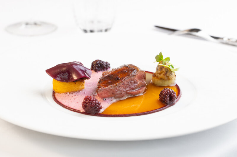 Roasted Anjou pigeon with blackberry, aubergine & polenta